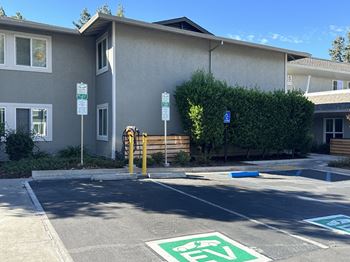 Electric vehicle chargers in the parking lot of the property